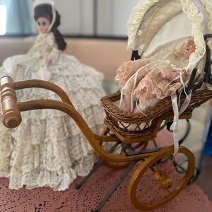 Vintage Doll with Lace Dress and Wicker Carriage